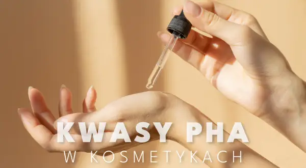 Delikatna pielęgnacja skóry z użyciem kwasów PHA. Kropla serum z pipety spada na dłoń, obiecując nawilżenie i odnowę.