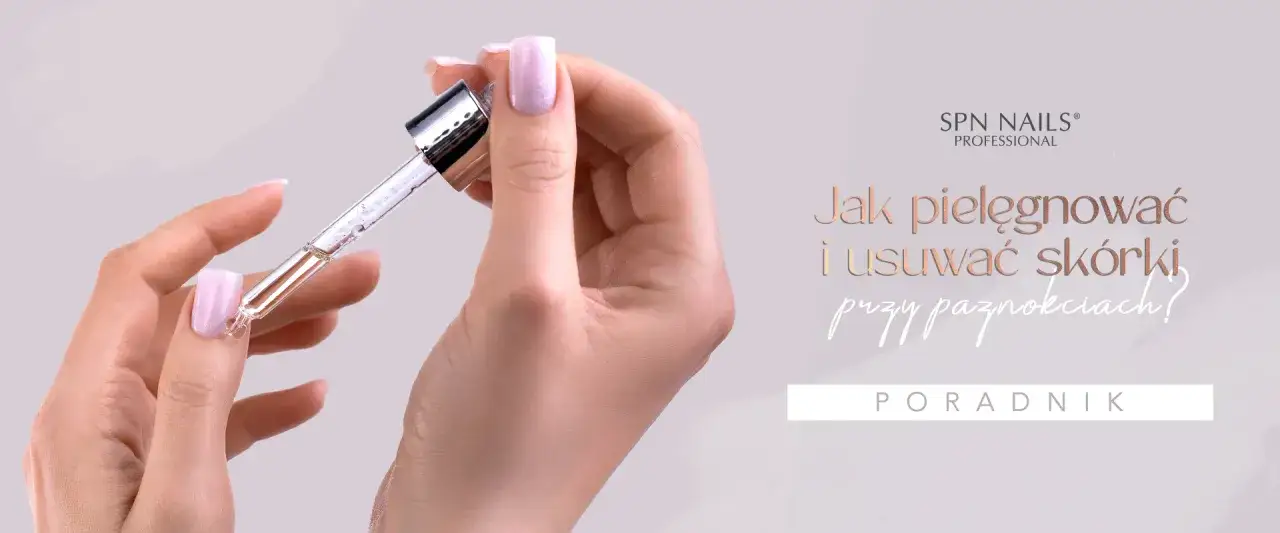 Dłoń z zadziorami przy paznokciach, na którą aplikowany jest olejek z pipety. Poradnik pielęgnacji skórek.